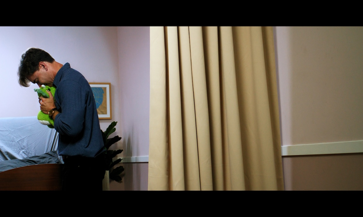 A man finding out his child has died in the hospital scene